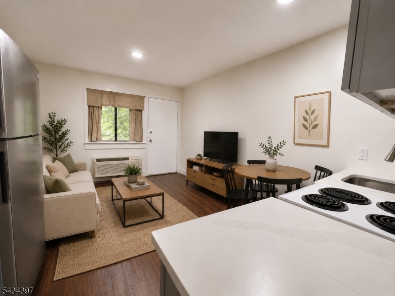207 Old Chimney Ridge Road, Unit L Montague, NJ 07827 - Photo 5 of 14 a bedroom with furniture and a flat screen tv
