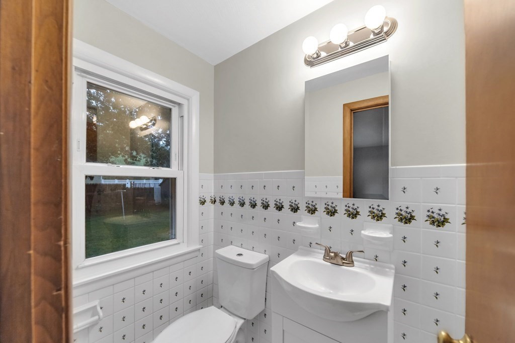 99 Bacon Road Springfield, MA 01119 - Photo 18 of 28 a bathroom with a sink mirror and toilet