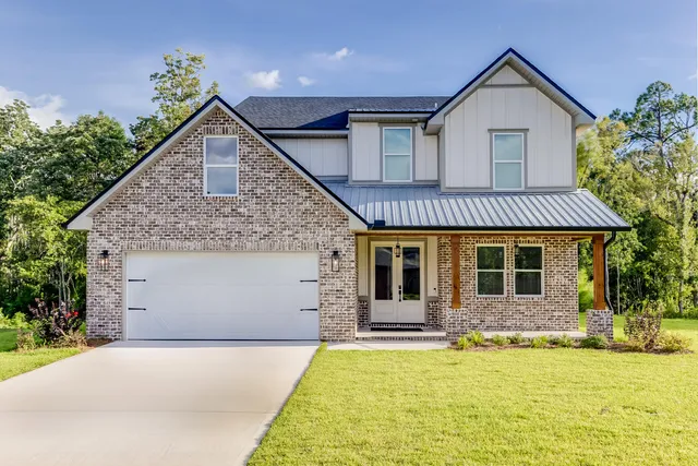 a front view of a house with yard