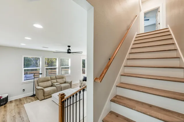 a bathroom with double vanity sinks and a mirror