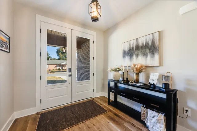 a bedroom with furniture and window