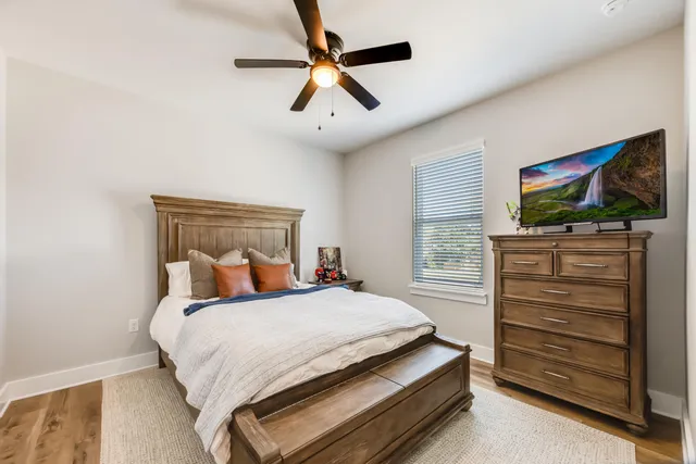 a view of a house with swimming pool and sitting area