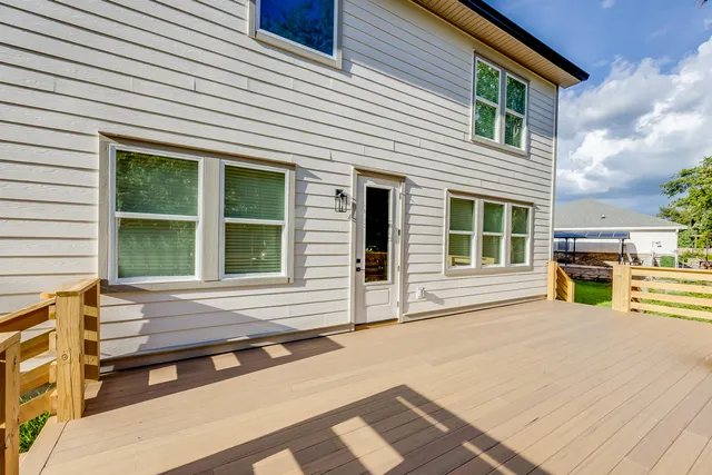 an aerial view of a house with yard swimming pool and outdoor seating