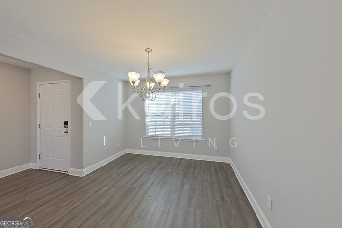 228 Western Red Cedar Drive Springfield, GA 31329 - Photo 2 of 27 wooden floor in an empty room with a window