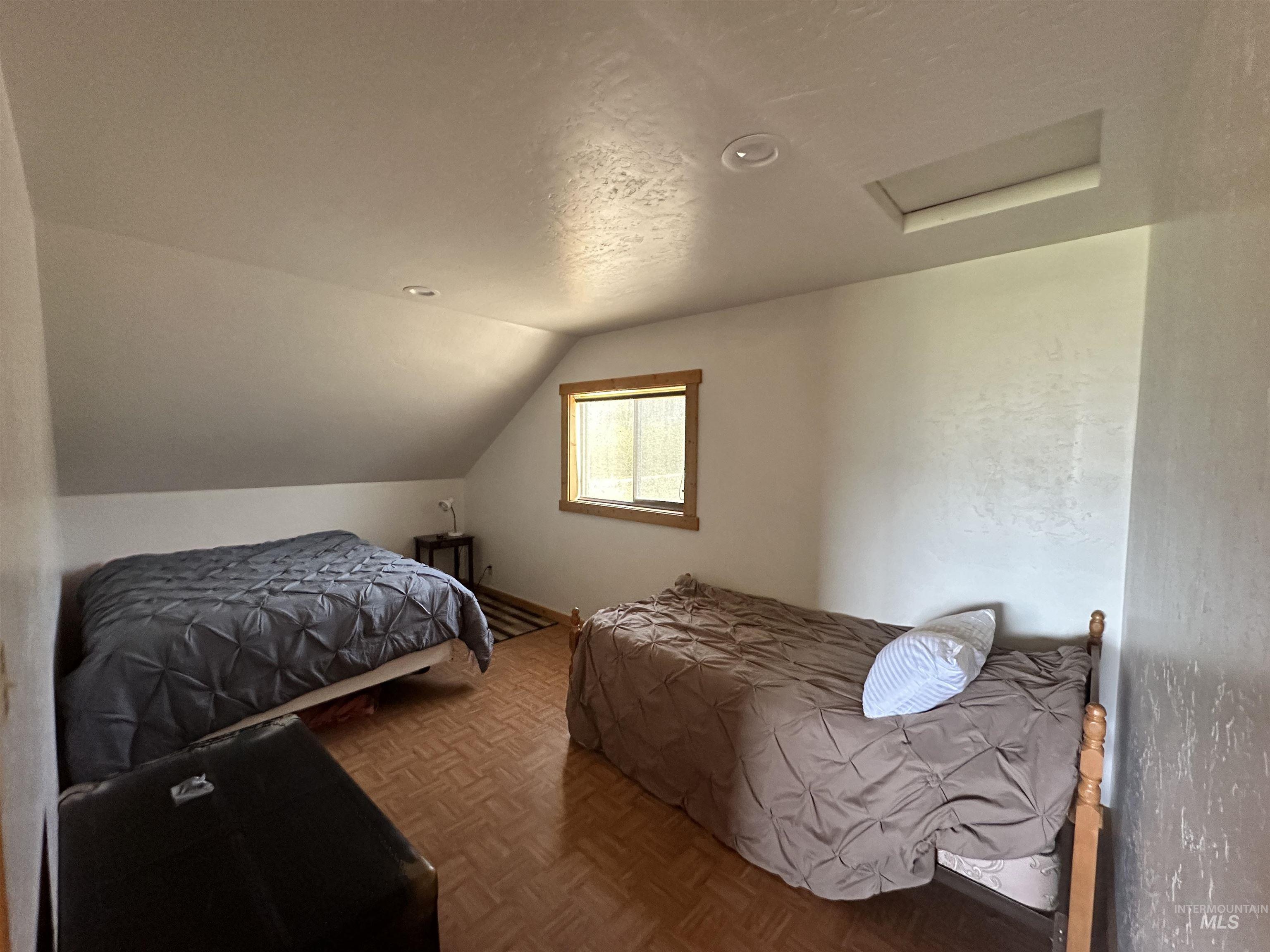532 Warren Creek Road McCall, ID 83638 - Photo 19 of 45 Bedroom with attic access, vaulted ceiling, and recessed lighting
