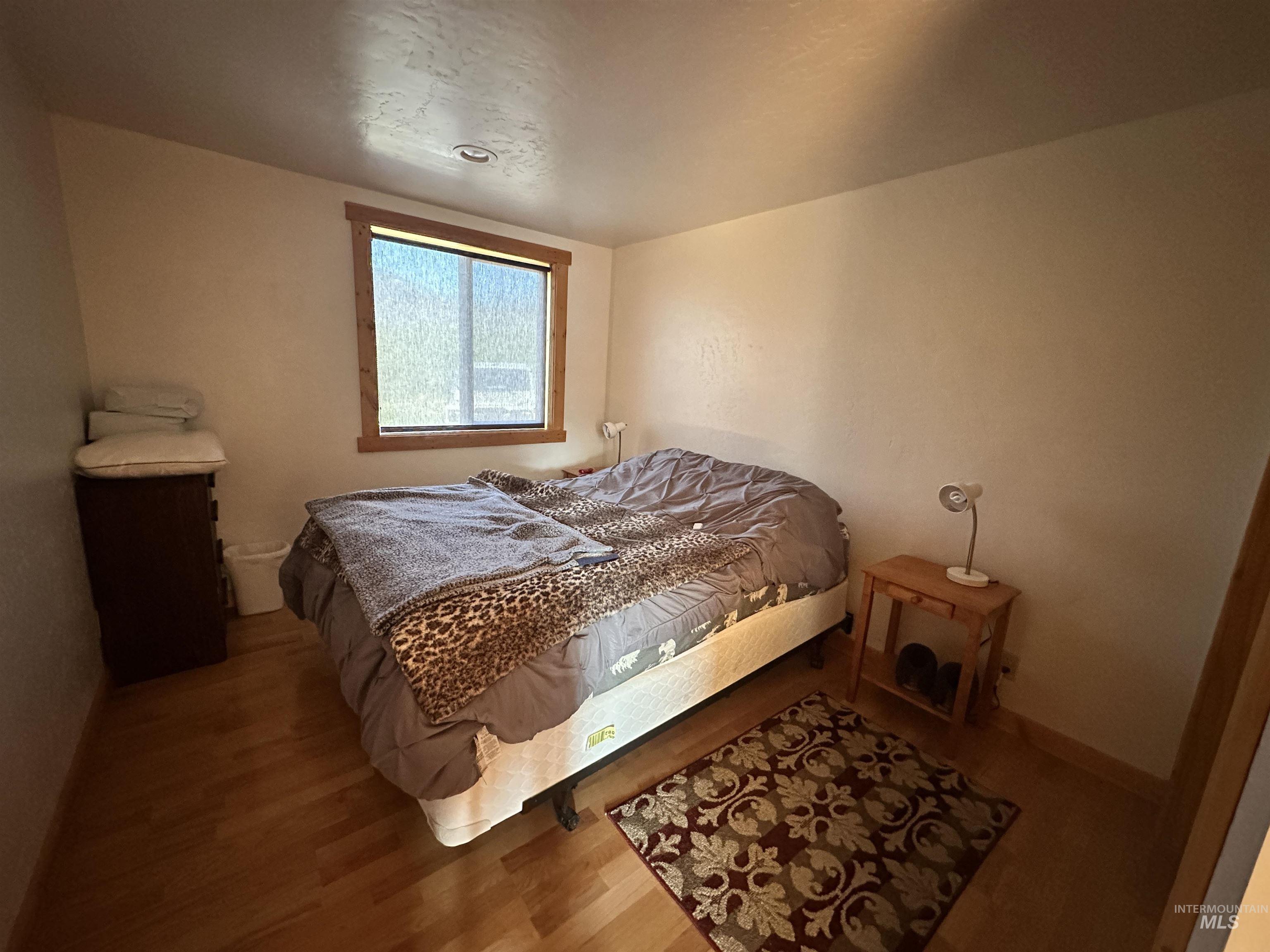 532 Warren Creek Road McCall, ID 83638 - Photo 21 of 45 Bedroom featuring wood finished floors and baseboards