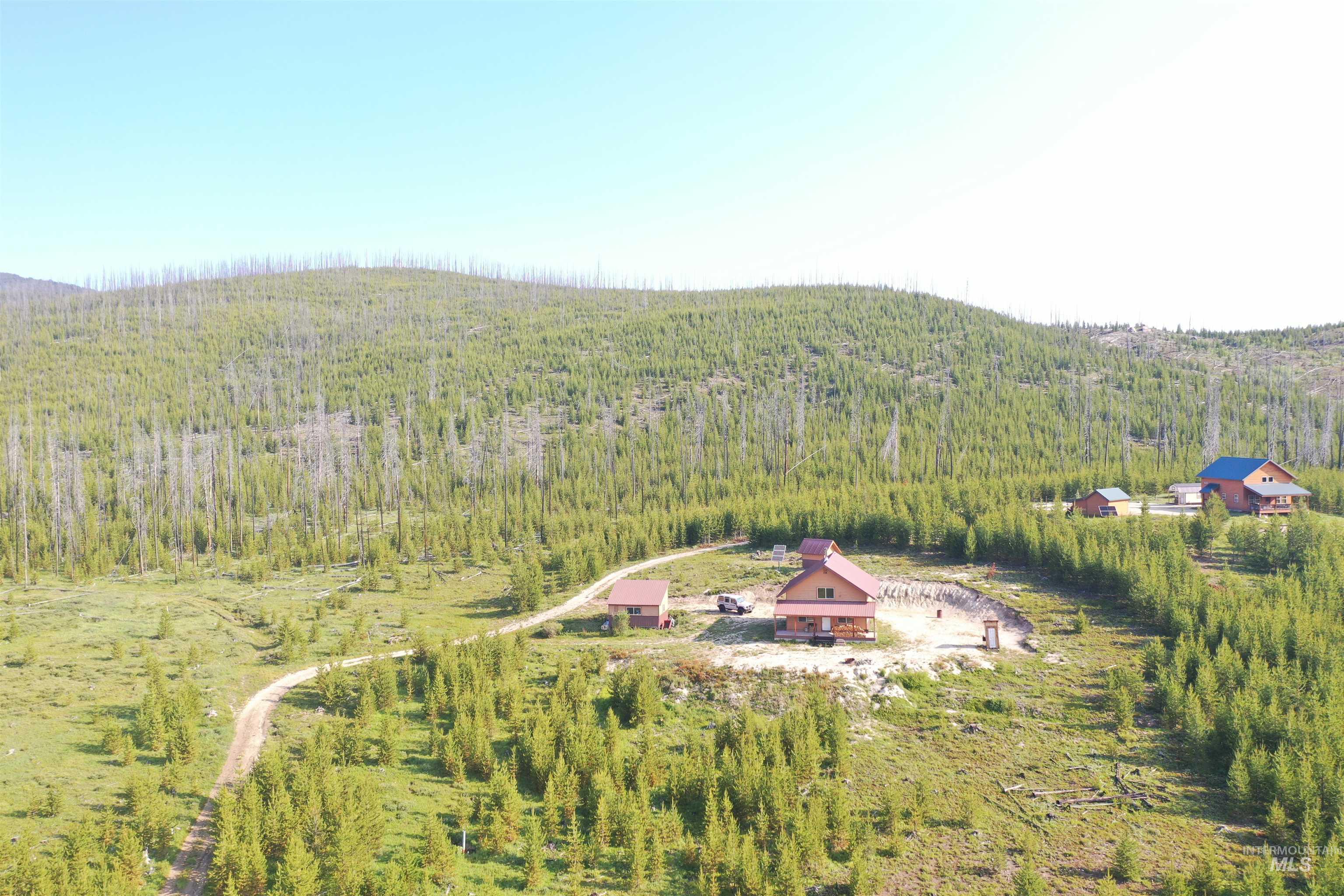 532 Warren Creek Road McCall, ID 83638 - Photo 9 of 45 Aerial view of property and surrounding area with a forest