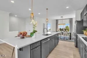 a kitchen with counter top space cabinets and appliances