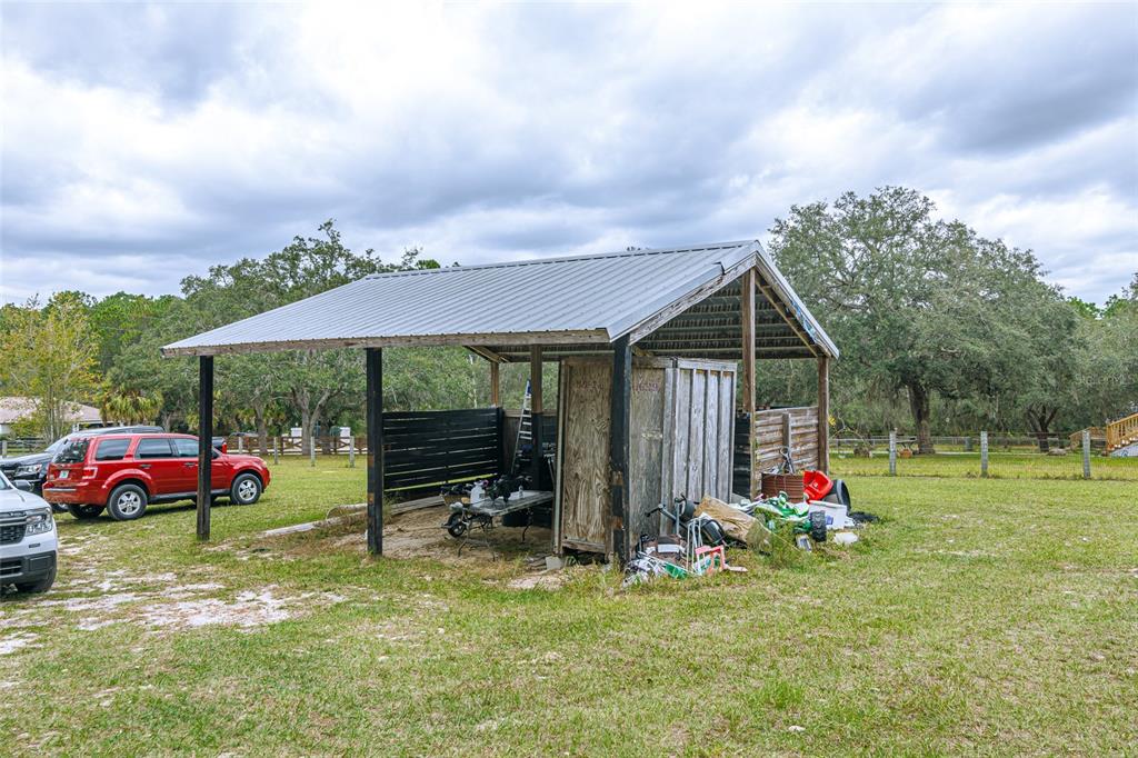 4225 Southwest 178th Terrace Dunnellon, FL 34432 - Photo 11 of 49 an outdoor space with furniture and garden