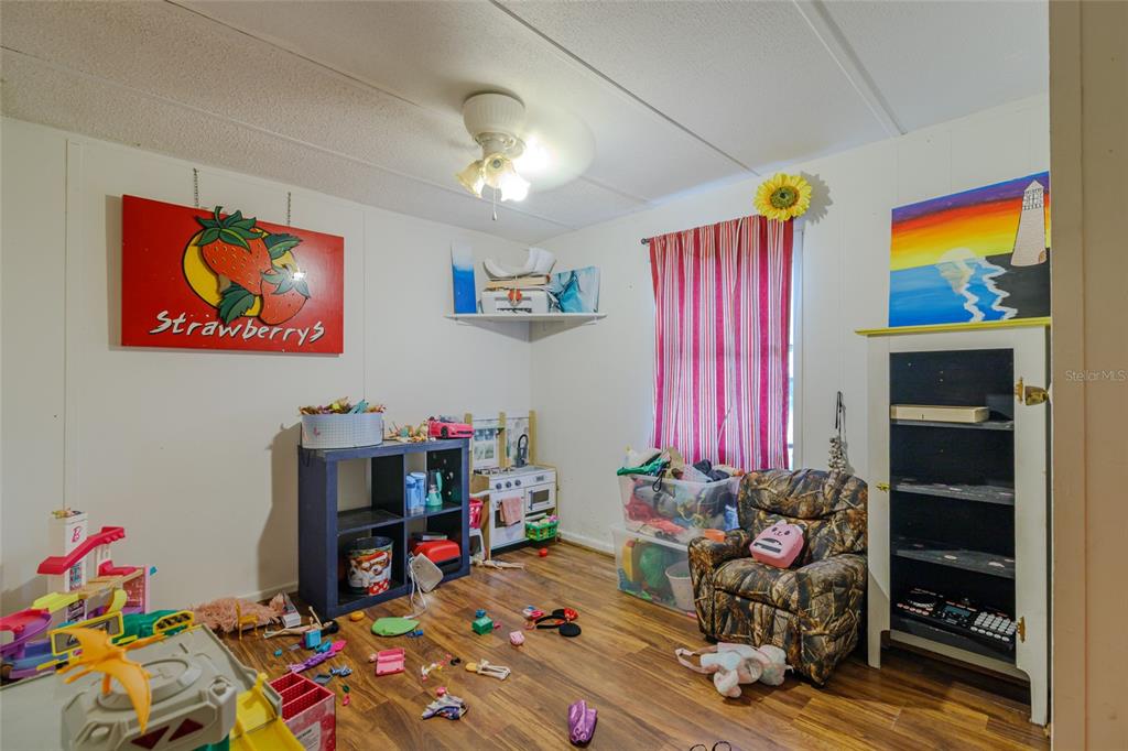 4225 Southwest 178th Terrace Dunnellon, FL 34432 - Photo 27 of 49 a room with toys and a wooden floor
