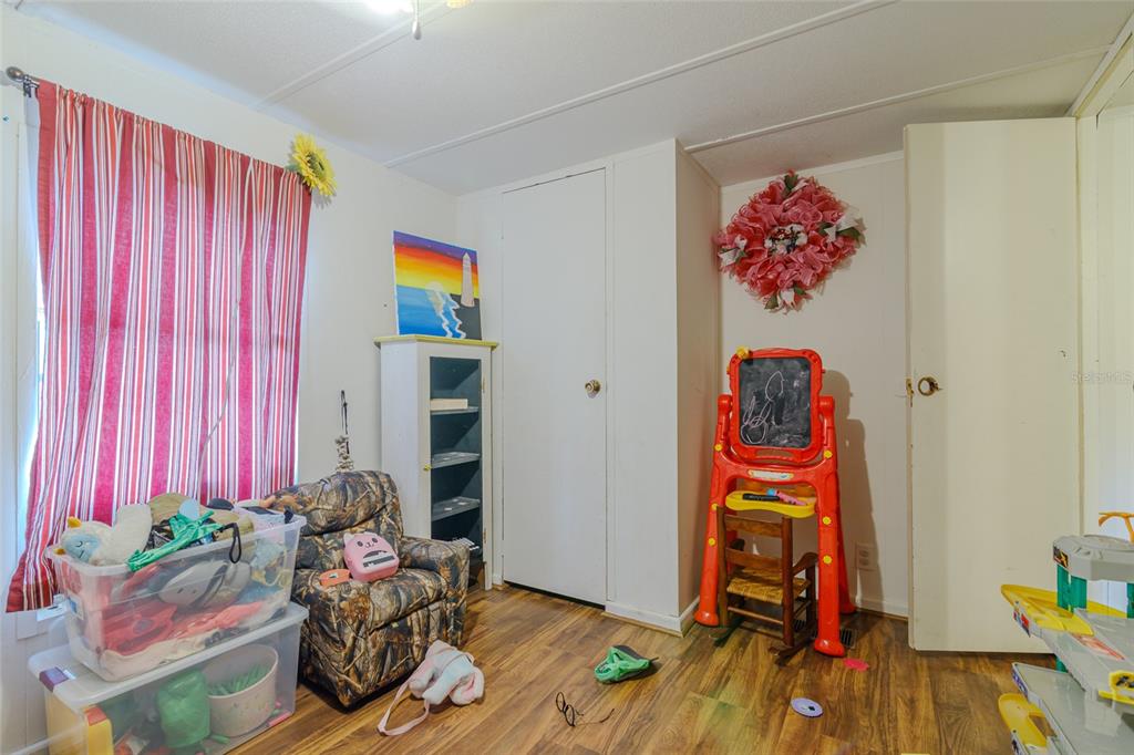 4225 Southwest 178th Terrace Dunnellon, FL 34432 - Photo 28 of 49 a living room with furniture and toys