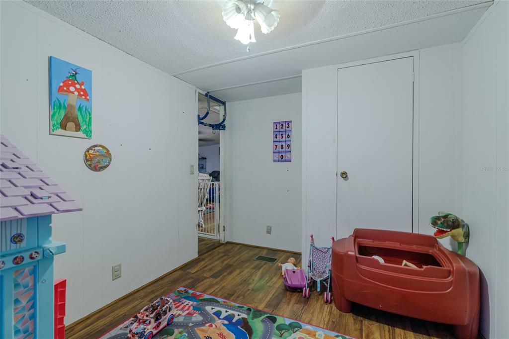 4225 Southwest 178th Terrace Dunnellon, FL 34432 - Photo 35 of 49 a bed room with a bed and a couch