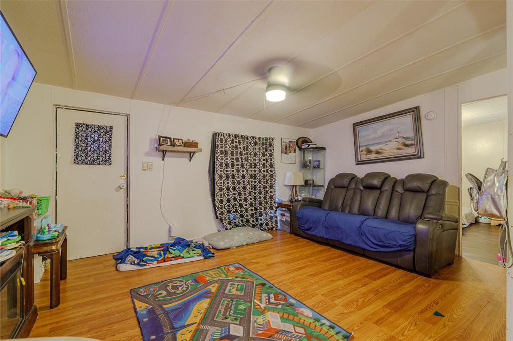 4225 Southwest 178th Terrace Dunnellon, FL 34432 - Photo 43 of 49 a bedroom with a bed and wooden floor