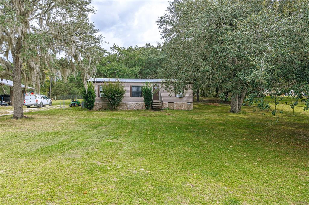 4225 Southwest 178th Terrace Dunnellon, FL 34432 - Photo 49 of 49 a view of a house with a yard