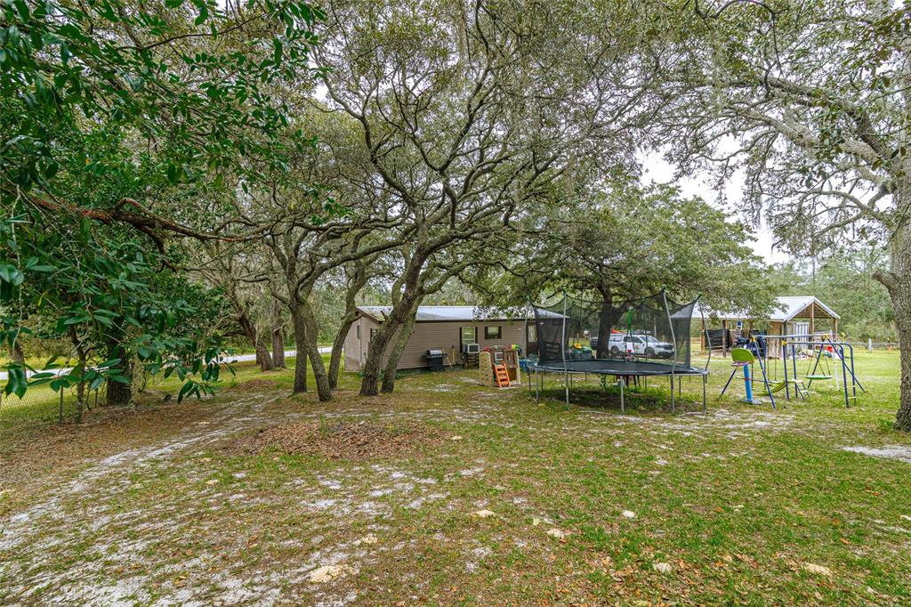 4225 Southwest 178th Terrace Dunnellon, FL 34432 - Photo 7 of 49 a view of a house with a yard