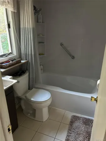 a bathroom with a toilet a sink and bathtub