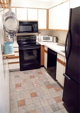 a kitchen with a stove and a sink