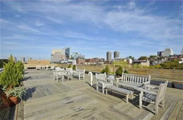 a view of roof deck with patio