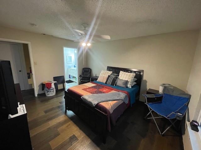 4245 Madera Road Irving, TX 75038 - Photo 7 of 10 Bedroom featuring a textured ceiling, dark wood finished floors, a ceiling fan, and ensuite bathroom