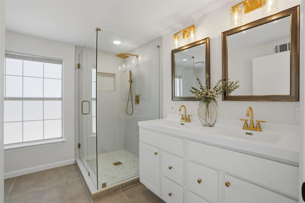 2012 Tennessee Avenue Dallas, TX 75224 - Photo 16 of 28 a bathroom with a shower sink vanity and mirror