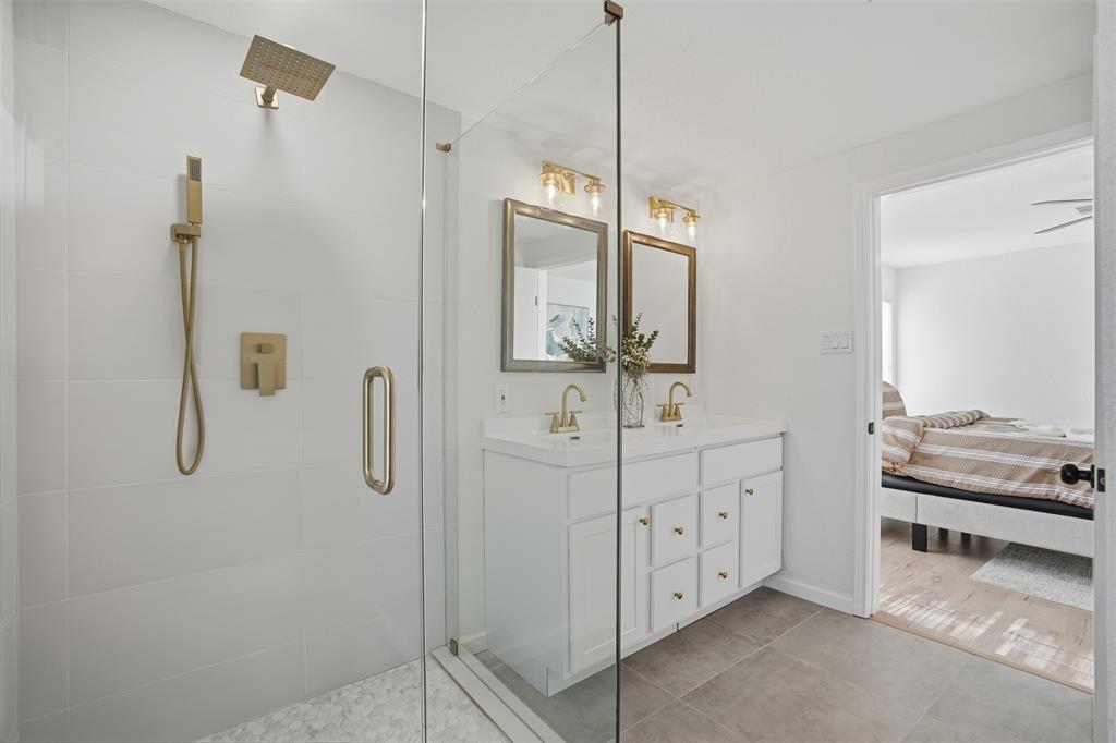 2012 Tennessee Avenue Dallas, TX 75224 - Photo 17 of 28 a spacious bathroom with a shower and mirror