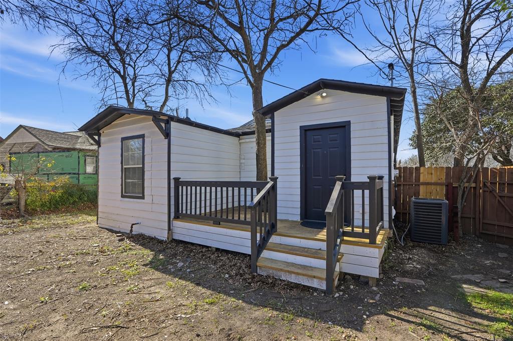 2012 Tennessee Avenue Dallas, TX 75224 - Photo 21 of 28 a front view of a house with a yard