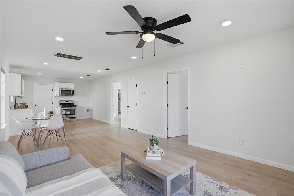 2012 Tennessee Avenue Dallas, TX 75224 - Photo 7 of 28 a living room with furniture and a view of kitchen