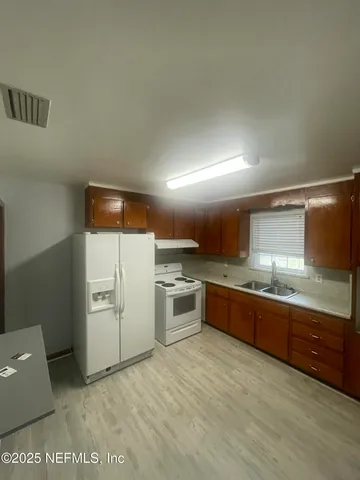 an empty room with a empty space and windows