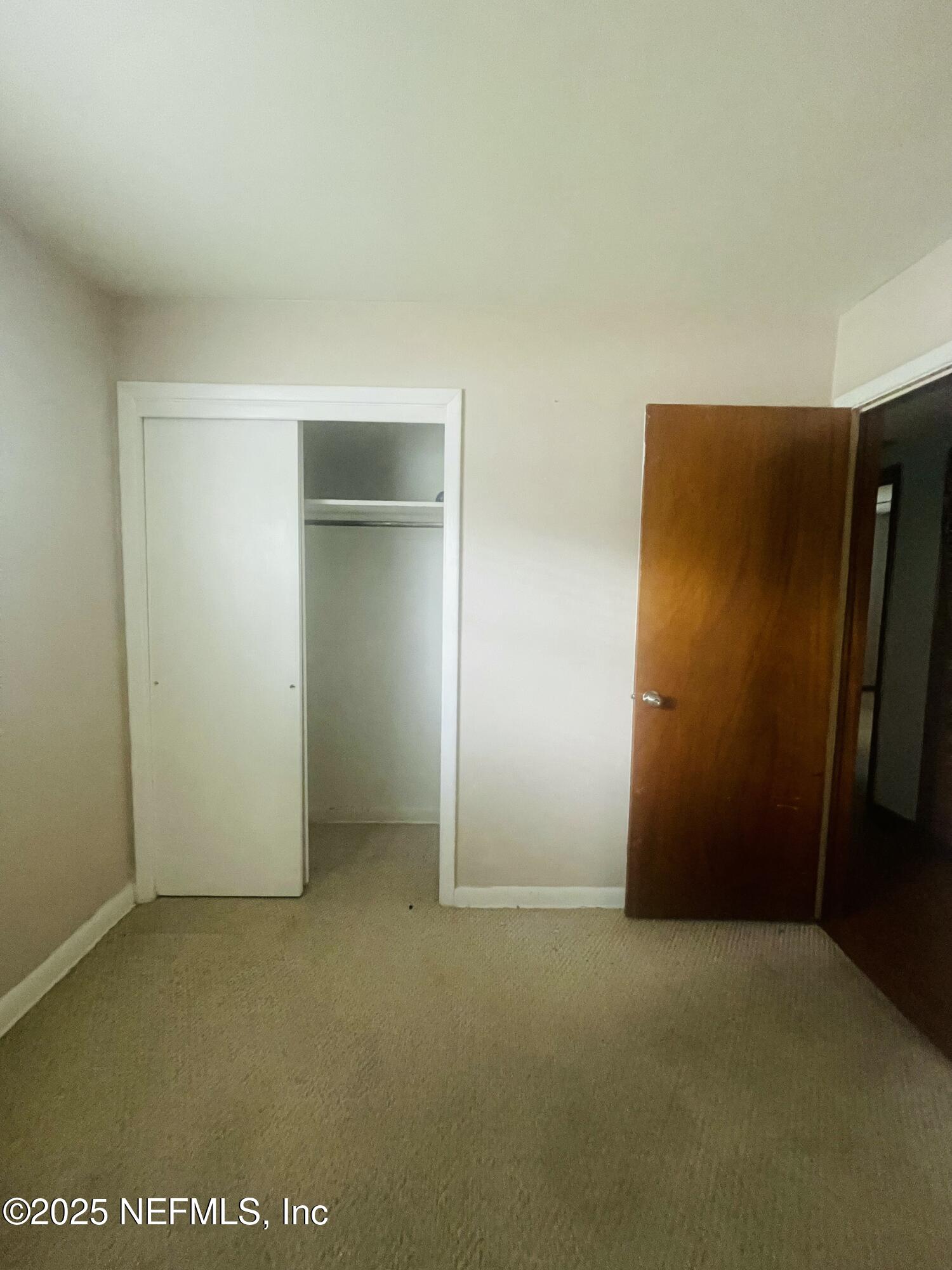 6643 Heidi Road Jacksonville, FL 32277 - Photo 18 of 45 an empty room with closet area
