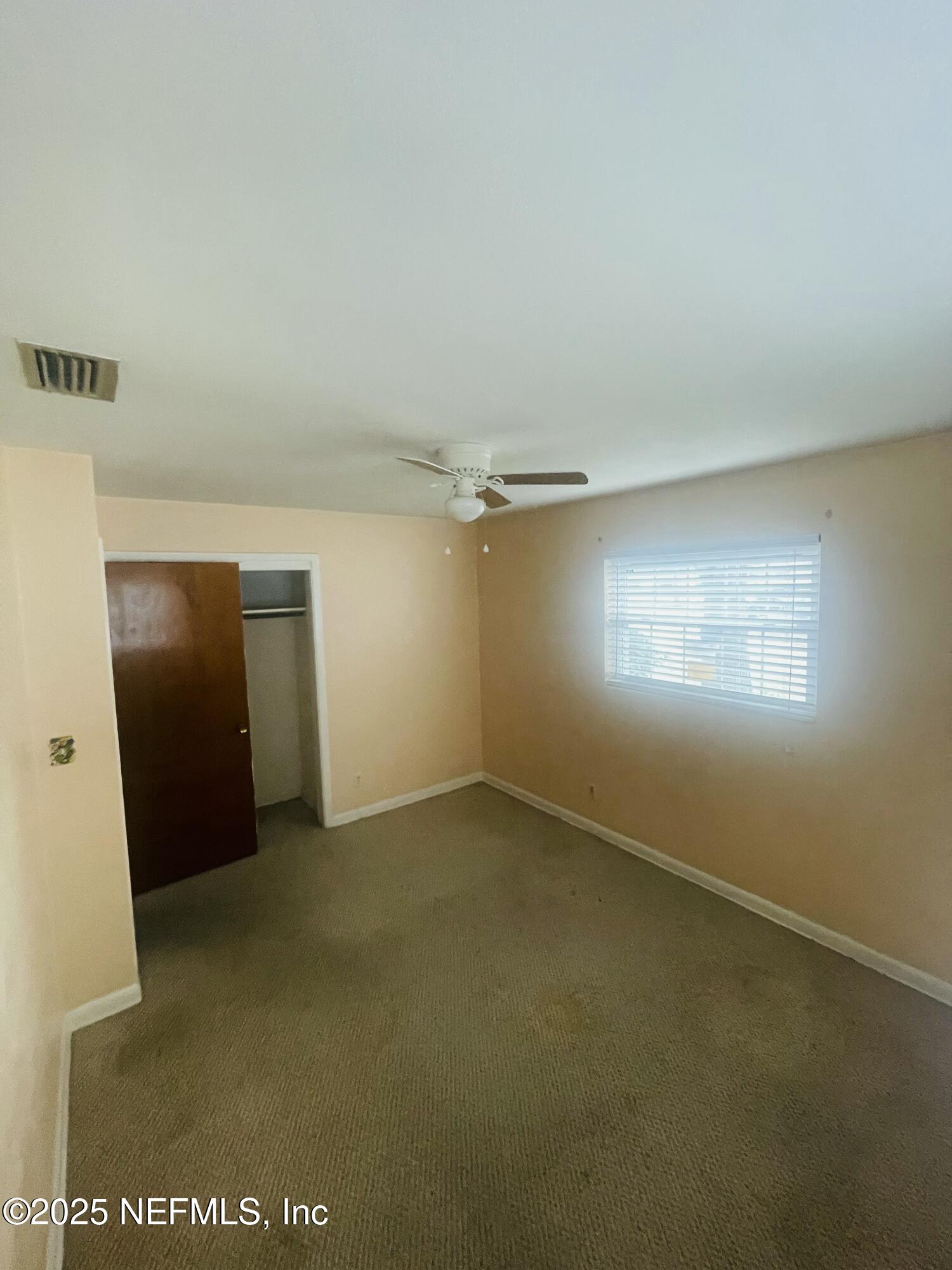 6643 Heidi Road Jacksonville, FL 32277 - Photo 20 of 45 an empty room with windows and closet