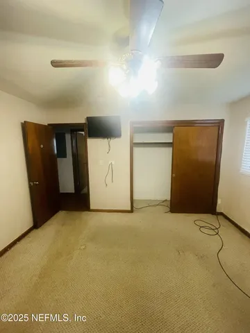 a bathroom with a sink mirror and toilet