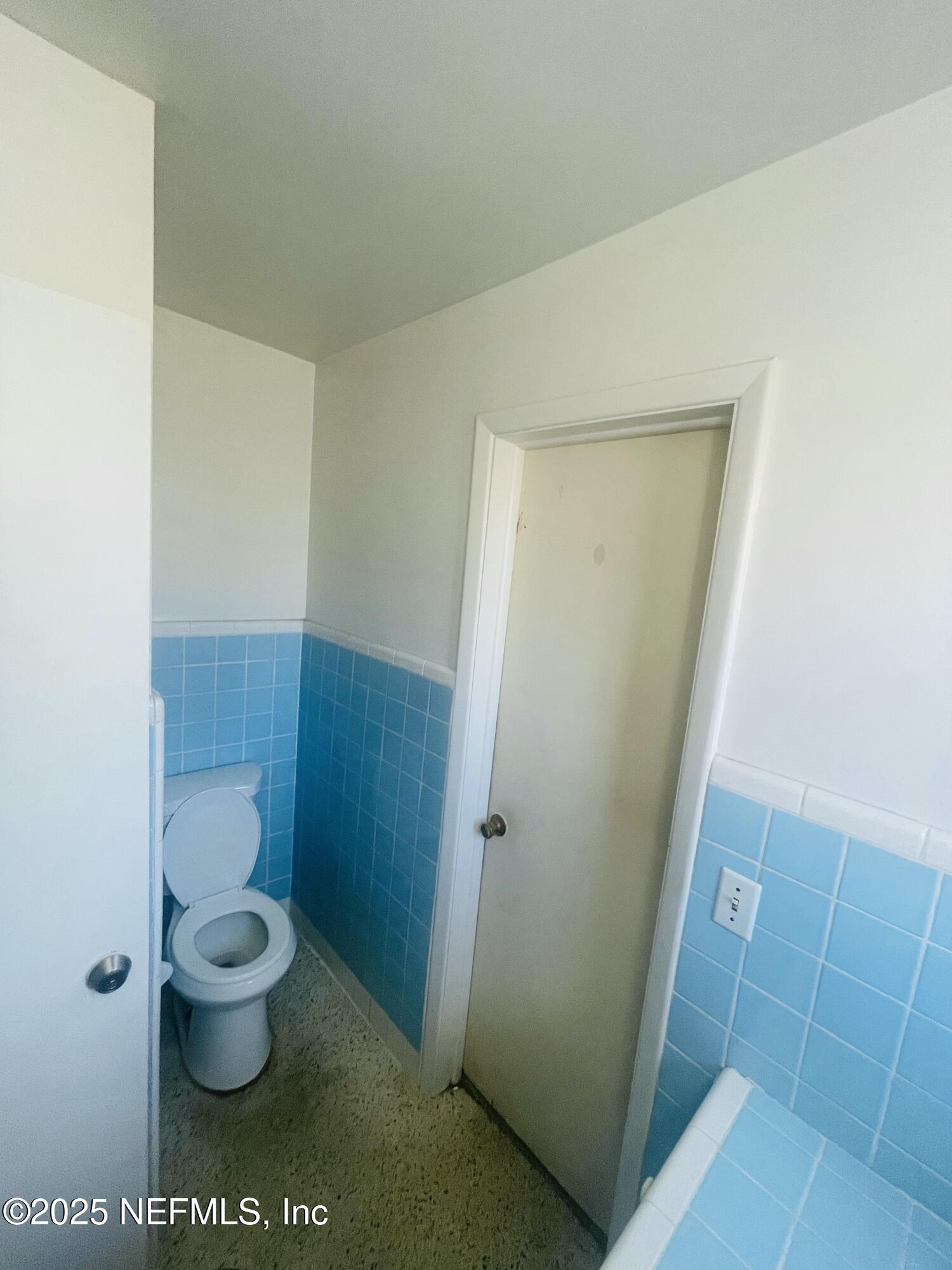 6643 Heidi Road Jacksonville, FL 32277 - Photo 27 of 45 a bathroom with a granite countertop toilet and a shower