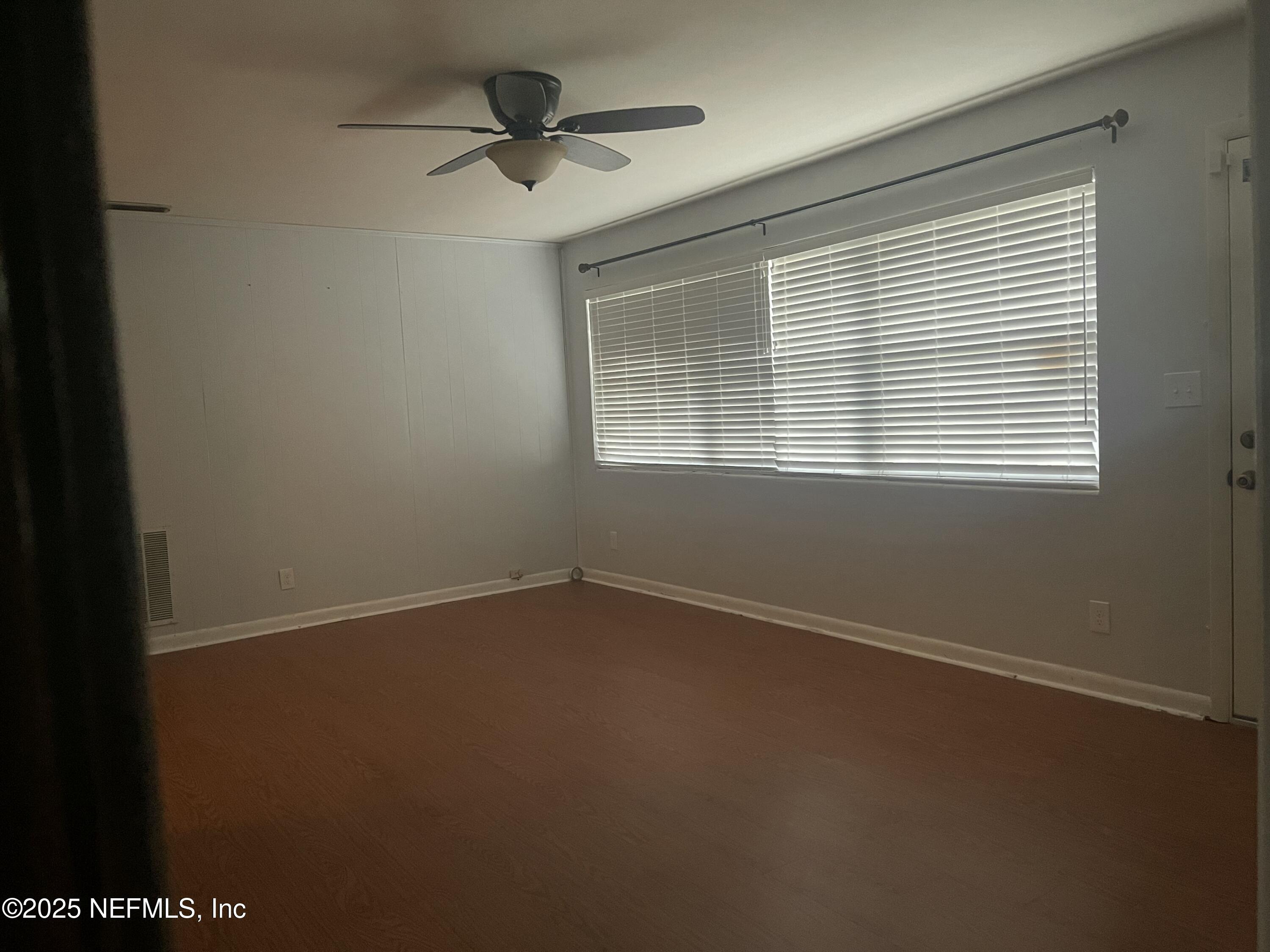 6643 Heidi Road Jacksonville, FL 32277 - Photo 3 of 45 a view of an empty room with a window