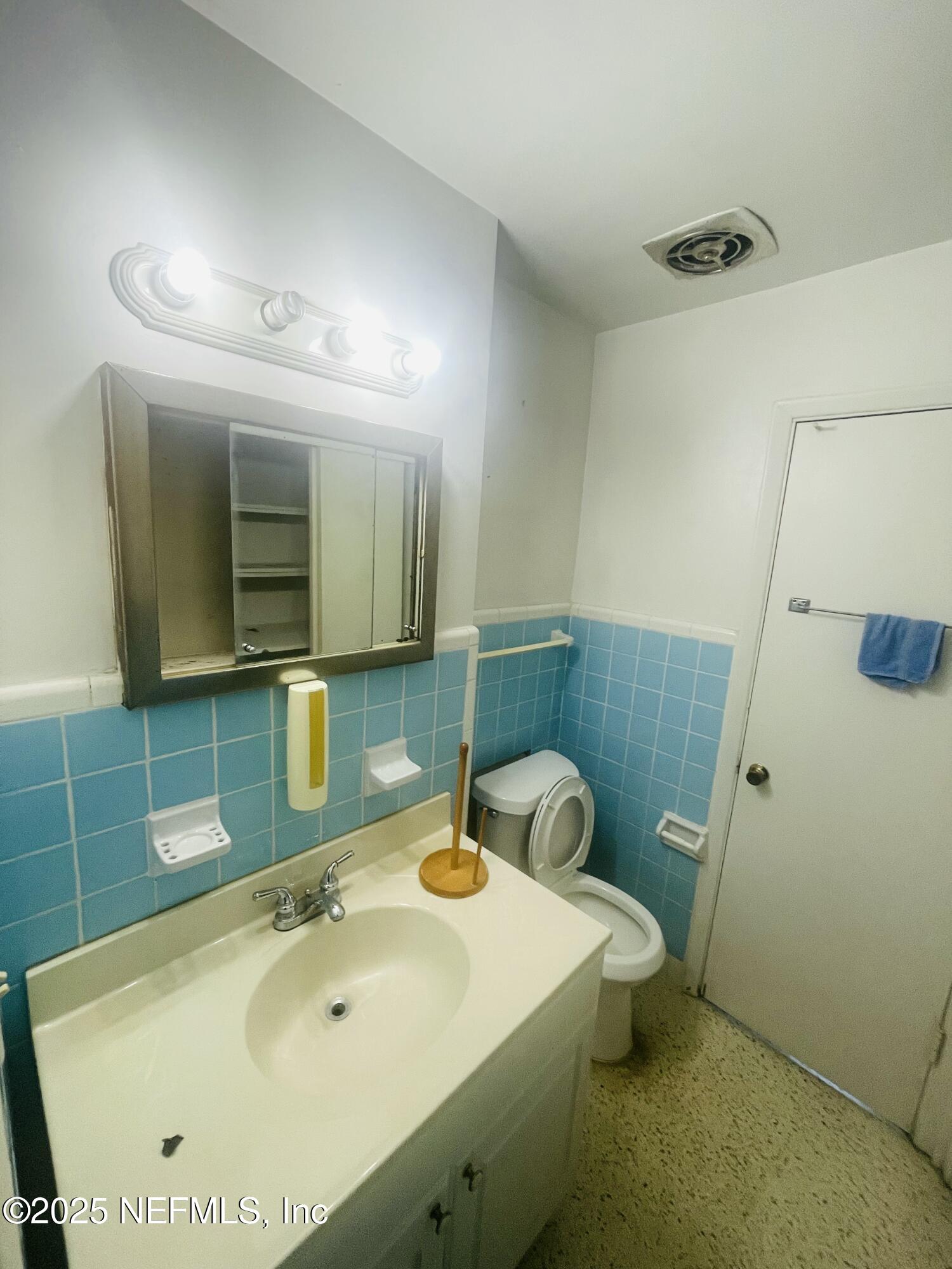 6643 Heidi Road Jacksonville, FL 32277 - Photo 34 of 45 a bathroom with a sink and a mirror