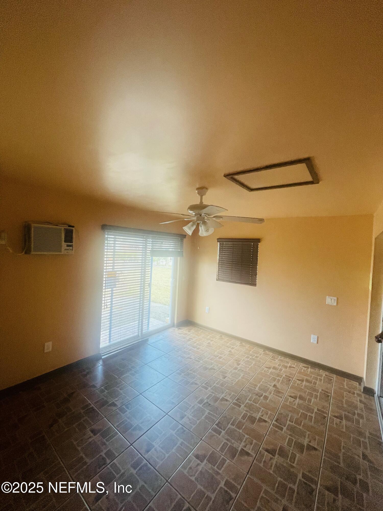 6643 Heidi Road Jacksonville, FL 32277 - Photo 36 of 45 an empty room with a empty space and a ceiling fan