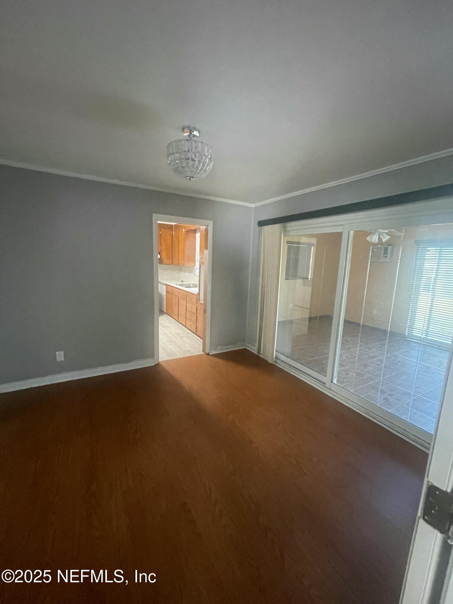 6643 Heidi Road Jacksonville, FL 32277 - Photo 7 of 45 an empty room with windows