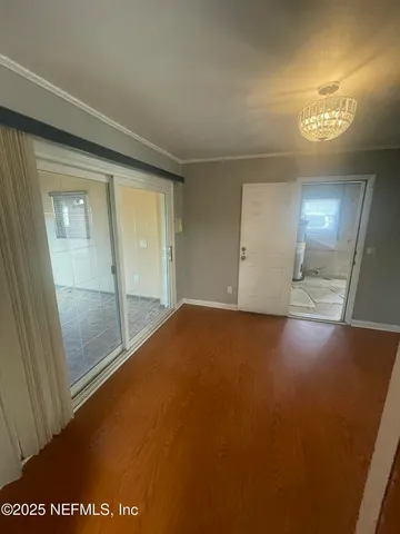 a large kitchen with a stove a sink and a refrigerator