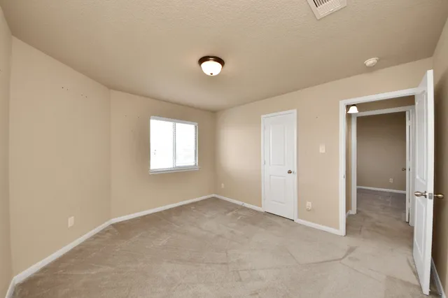 an aerial view of a house with swimming pool and garden
