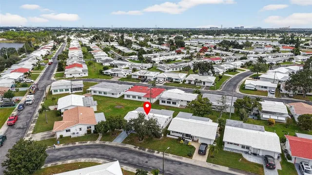 an aerial view of residential houses with outdoor space