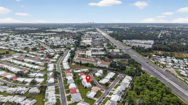a view of a house with swimming pool and a yard