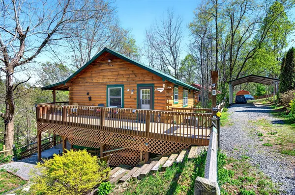a view of a chair and table in the backyard