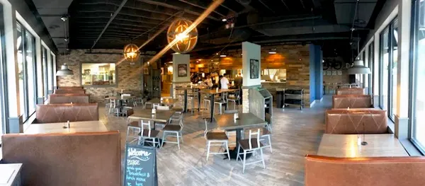 a view of swimming pool with outdoor seating