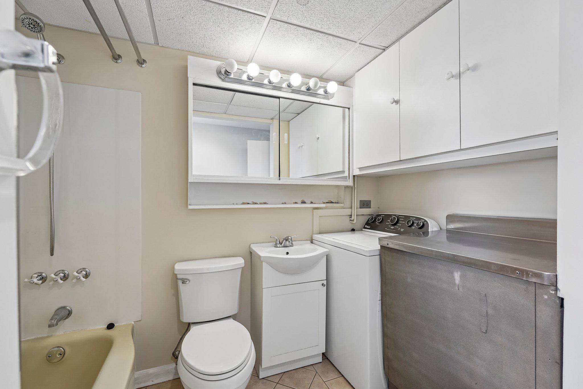 9 Rustleaf Lane Levittown, PA 19055 - Photo 8 of 45 Main floor Bathroom and Laundry