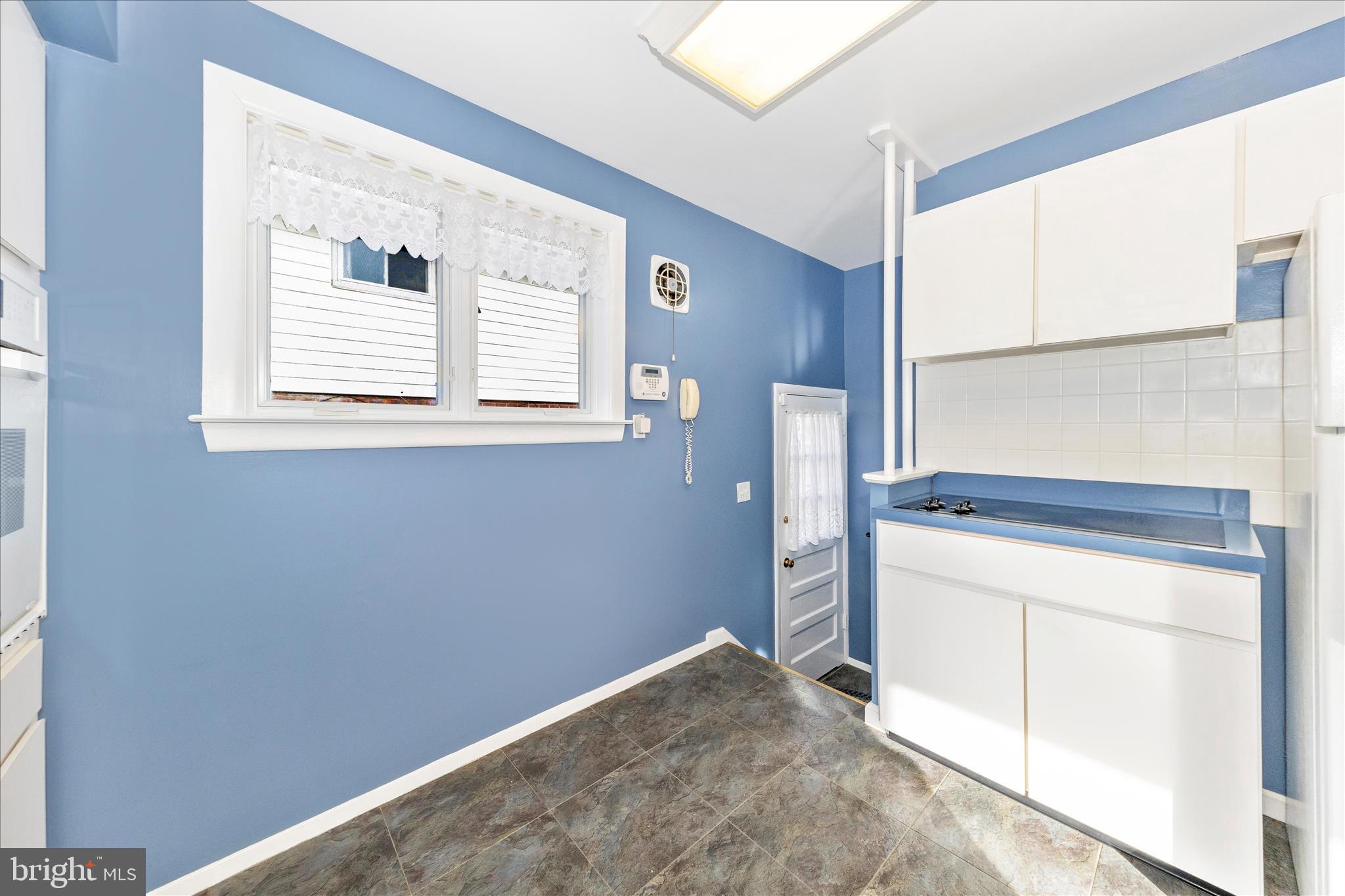 11802 Pittson Road Silver Spring, MD 20906 - Photo 16 of 50 a view of a kitchen with storage and utility