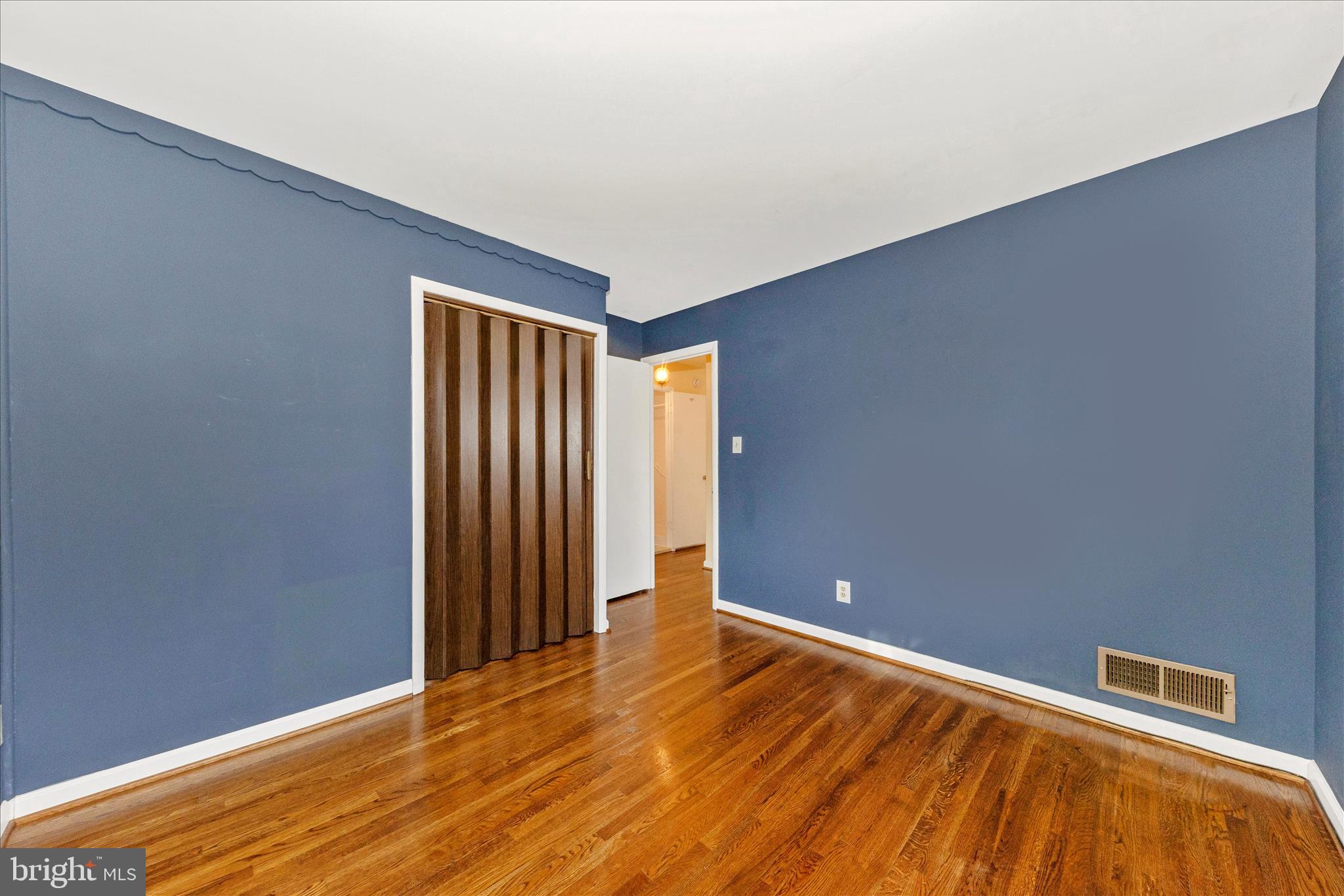 11802 Pittson Road Silver Spring, MD 20906 - Photo 26 of 50 a view of an empty room with wooden floor
