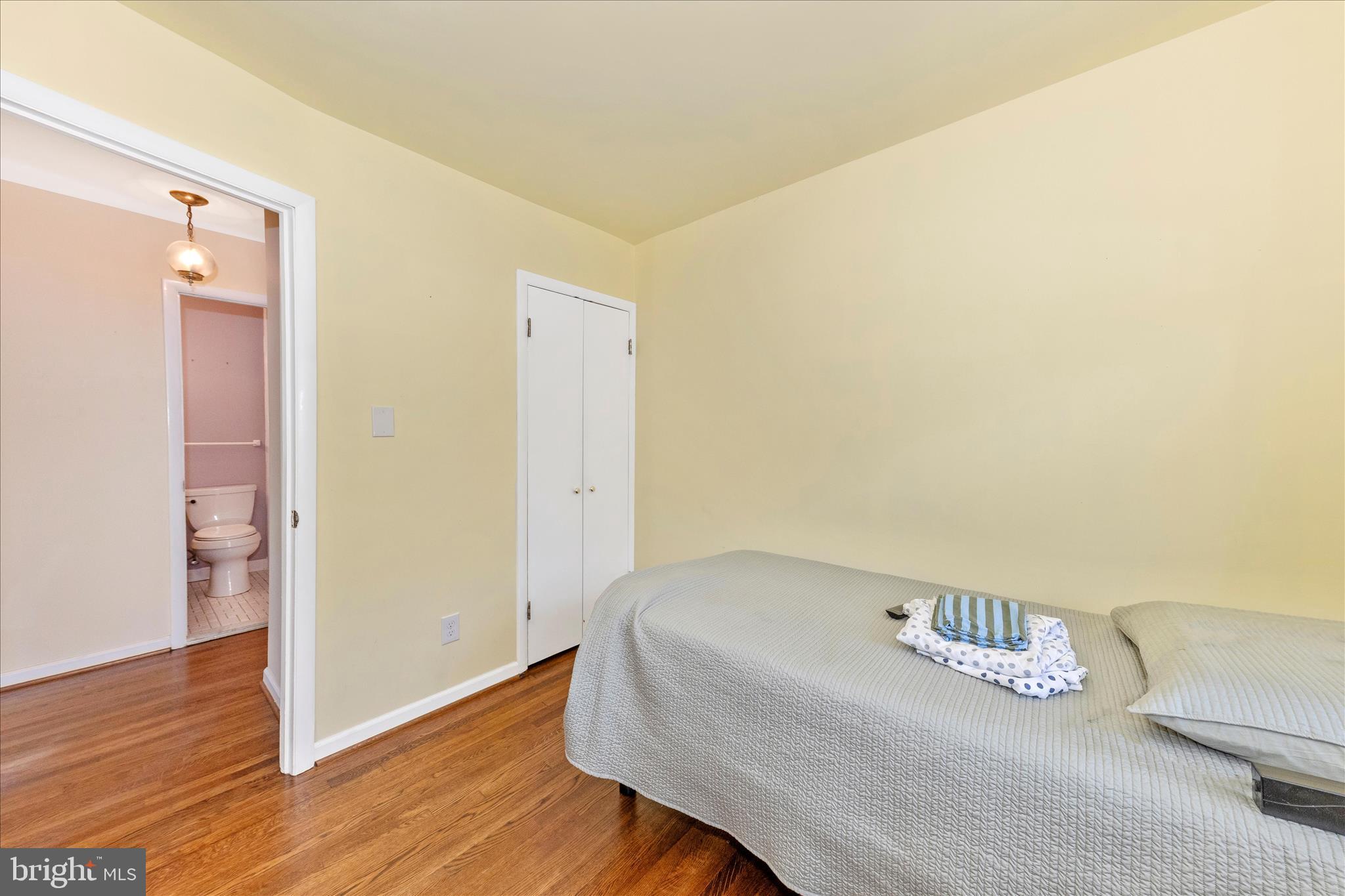 11802 Pittson Road Silver Spring, MD 20906 - Photo 30 of 50 a bedroom with a bed and wooden floor