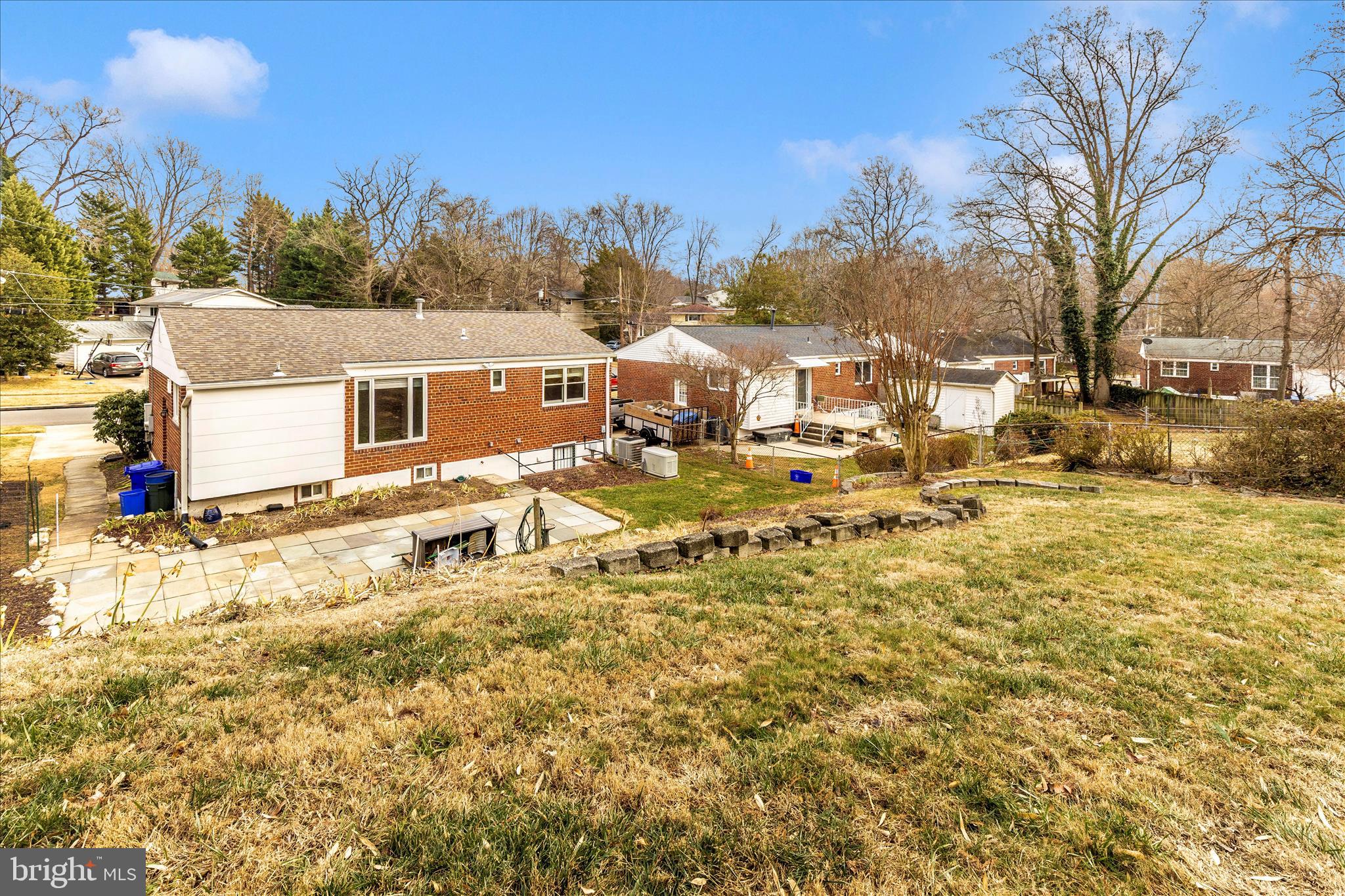 11802 Pittson Road Silver Spring, MD 20906 - Photo 47 of 50 a view of a white house with a yard covered with snow in front of house