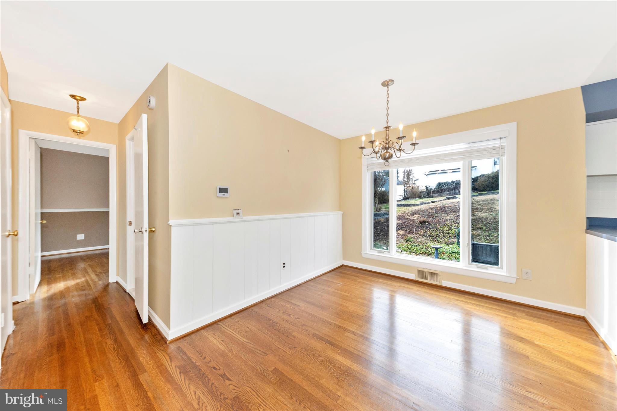 11802 Pittson Road Silver Spring, MD 20906 - Photo 10 of 50 a view of an empty room with wooden floor and a window