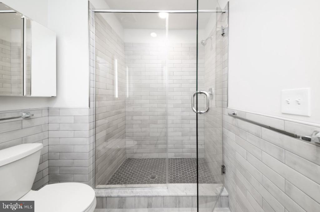 222 West Rittenhouse Square, Unit 1004 Philadelphia, PA 19103 - Photo 3 of 29 a bathroom with a toilet and a shower