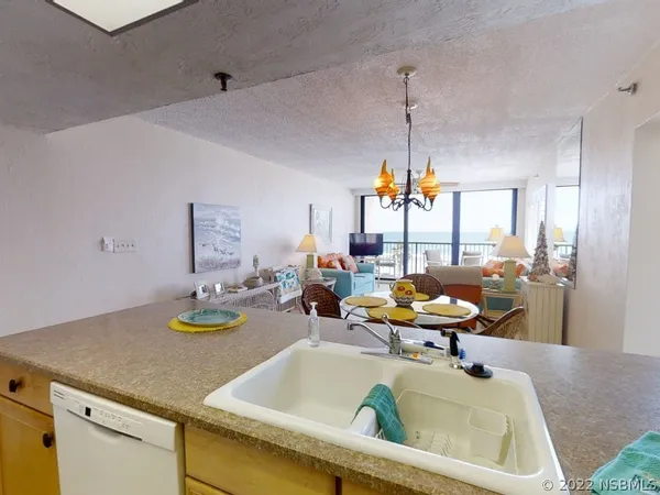 a view of a dining table and chairs in the kitchen